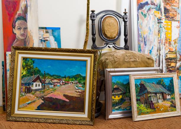 Collection of different types of handmade framed paintings in the workshop. Collection of different types of handmade framed paintings in the workshop.